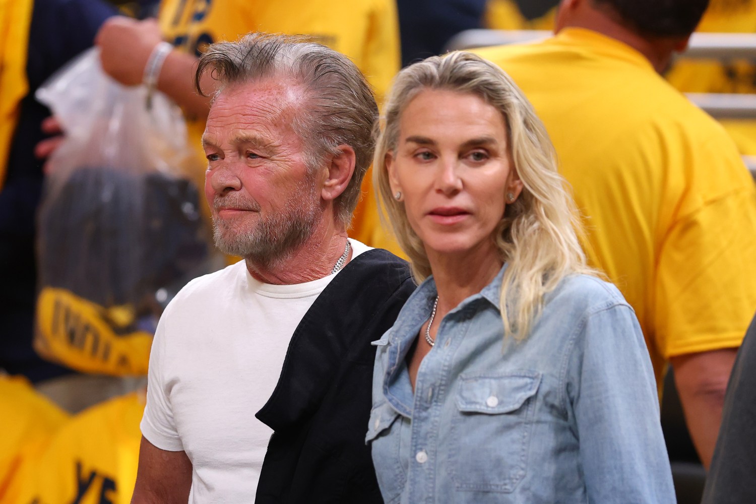 INDIANAPOLIS, INDIANA - MAY 27: John Mellencamp and Kristin Kehrberg are seen prior to Game Four of the Eastern Conference Finals of the 2025 NBA Playoffs between the New York Knicks and the Indiana Pacers at Gainbridge Fieldhouse on May 27, 2025 in Indianapolis, Indiana. NOTE TO USER: User expressly acknowledges and agrees that, by downloading and or using this photograph, User is consenting to the terms and conditions of the Getty Images License Agreement. (Photo by Gregory Shamus/Getty Images)