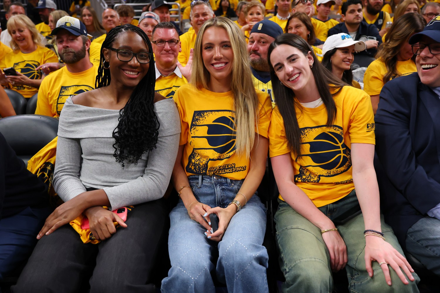 INDIANAPOLIS, INDIANA - MAY 31: Aliyah Boston, Lexie Hull and Caitlin Clark of the Indiana Fever attend Game Six of the Eastern Conference Finals of the 2025 NBA Playoffs between the New York Knicks and the Indiana Pacers at Gainbridge Fieldhouse on May 31, 2025 in Indianapolis, Indiana. NOTE TO USER: User expressly acknowledges and agrees that, by downloading and or using this photograph, User is consenting to the terms and conditions of the Getty Images License Agreement. (Photo by Gregory Shamus/Getty Images)